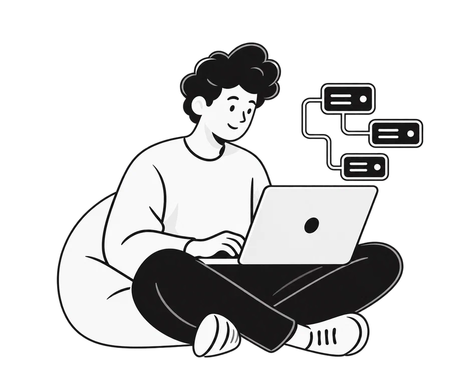 Software engineer working on a laptop beside connected system components